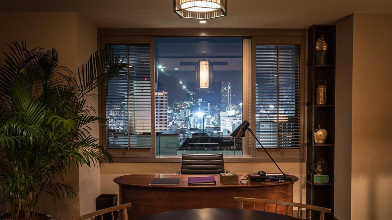 Oriental Hotel Kobe Exteriör bild A view of the Hong Kong skyline from the office of a private banker at the Mandarin Oriental, Hong Kong
